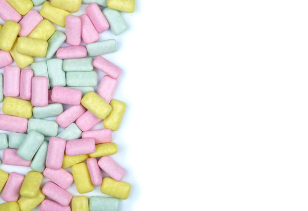 istock Brightly colored chewing gum laying flat isolated on white background 879770394