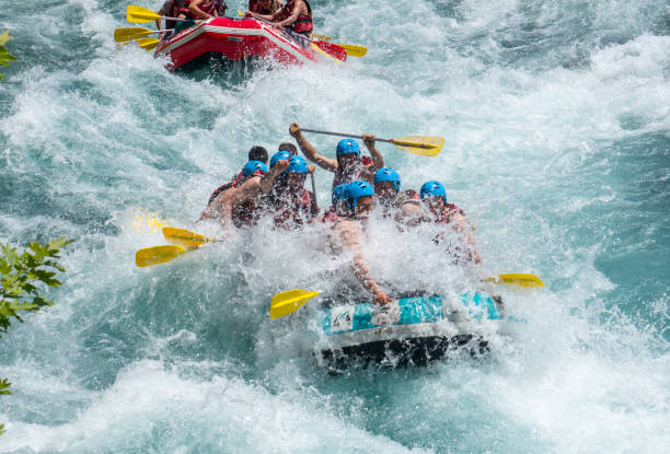 group of people white water rafting - team sport rafting white water rafting rapid imagens e fotografias de stock