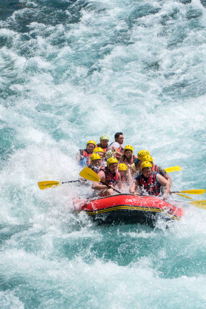 group of people white water rafting - white water rafting rafting rapid river imagens e fotografias de stock