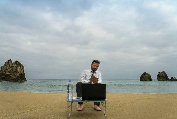 istock Businessman on the Beach - Work Follow 879781522