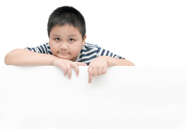 istock obese fat boy pointing on white banner board isolated 879784608