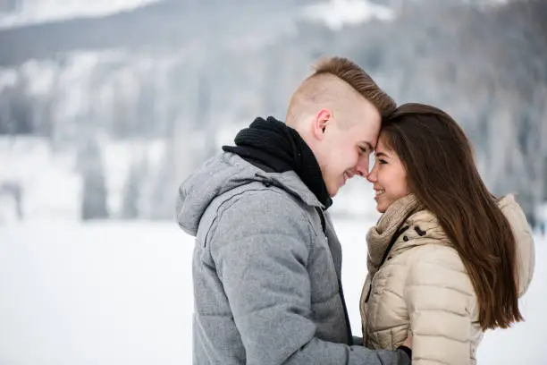 Smiling couple engaged in romantic mood