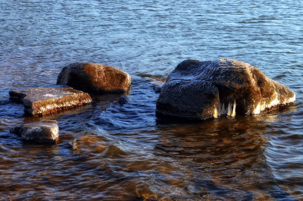 istock shore of the freezing river 879791474