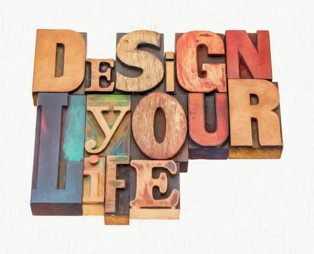 design your life - motivational advice - word abstract in mixed vintage letterpress printing blocks with digital painting effect applied