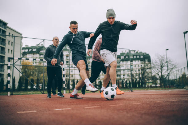 Friends playing soccer
