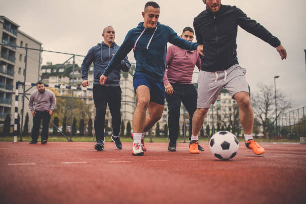 istock Playing soccer outdoors 879798810