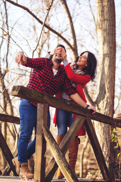 istock Romantic young couple walking together in countryside 879801682