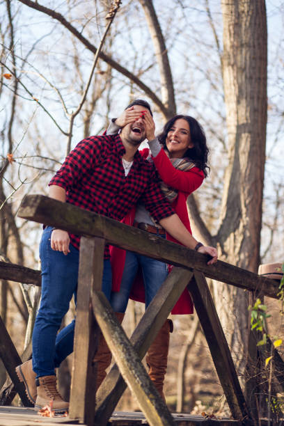istock Romantic young couple walking together in countryside 879801864
