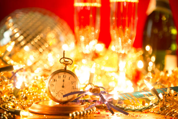 istock New Year's Eve holiday party, pocket watch, clock at midnight. 879802474