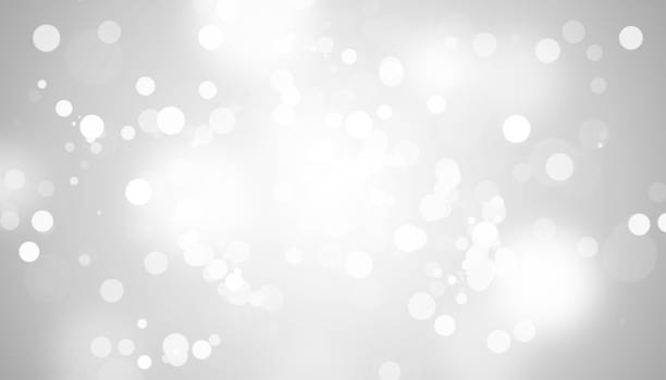 istock white blur abstract background. bokeh christmas blurred beautiful shiny Christmas lights 879806904