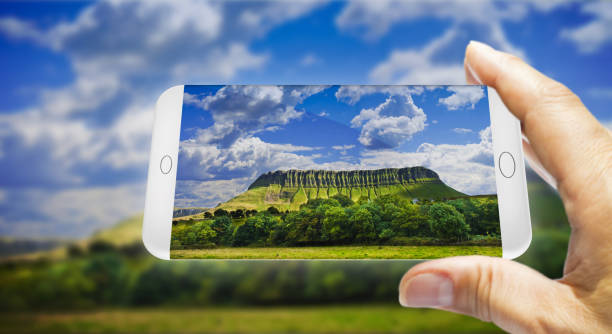 Typical Irish landscape with the Ben Bulben mountain called "table mountain" for its particular shape (county of Sligo - Ireland) - Smartphone concept with 3D render Typical Irish landscape with the Ben Bulben mountain called "table mountain" for its particular shape (county of Sligo - Ireland) - Smartphone concept with 3D render ben bulben stock pictures, royalty-free photos & images