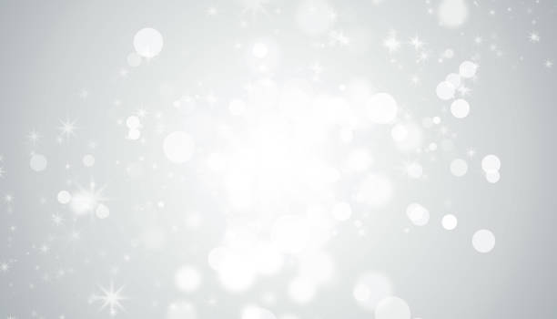 istock white blur abstract background. bokeh christmas blurred beautiful shiny Christmas lights 879809308