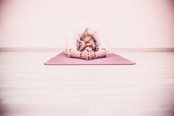 Kundalini Yoga Meditation in Baby Pose, Garbhasana stock photo