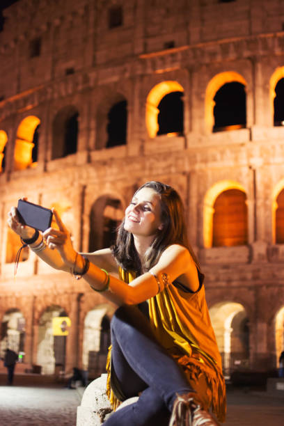 istock Smiling girl with phone 879809446