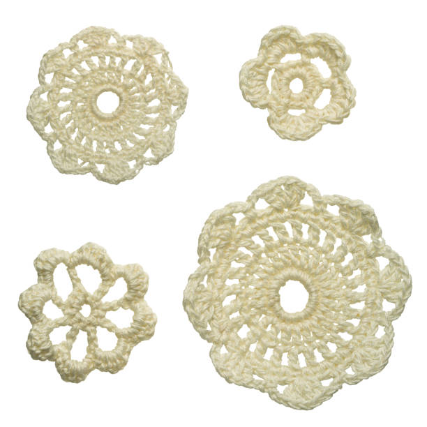 set of different size white crocheted floral doilies isolated on white background set of different size white crocheted floral doilies isolated on white background lace doily crochet craft product stock pictures, royalty-free photos & images