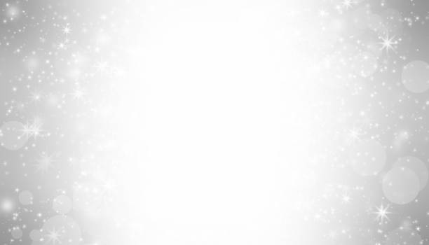 istock white blur abstract background. bokeh christmas blurred beautiful shiny Christmas lights 879813294