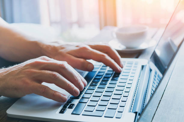 hands of business person working on computer close up of hands of business person working on computer, man using internet and social media form submission stock pictures, royalty-free photos & images