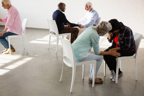 istock Senior people sitting face to face 879819294