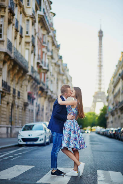istock Romantic couple near the Eiffel tower in Paris 879824504