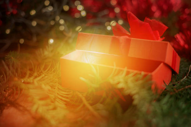 istock Close up on red christmas box gift, magicial effect 879827774
