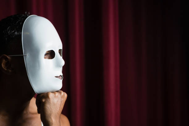 Artist wearing white mask on his face in stage