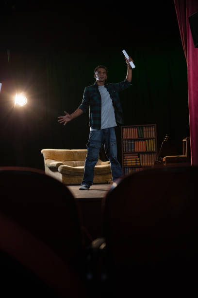 istock Artist rehearsing on stage 879828572