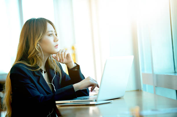 istock Dream soft style young woman sitting at her desk  while daydreaming. Feeling too soft dream moment. 879828694