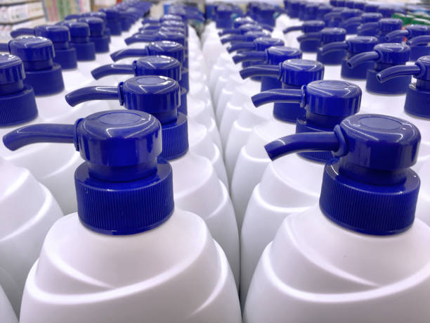 istock White Shampoo Bottles with Blue Dispensing Caps 879829040