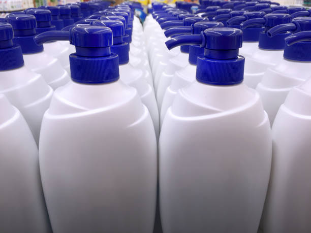 istock White Shampoo Bottles with Blue Dispensing Caps 879829080