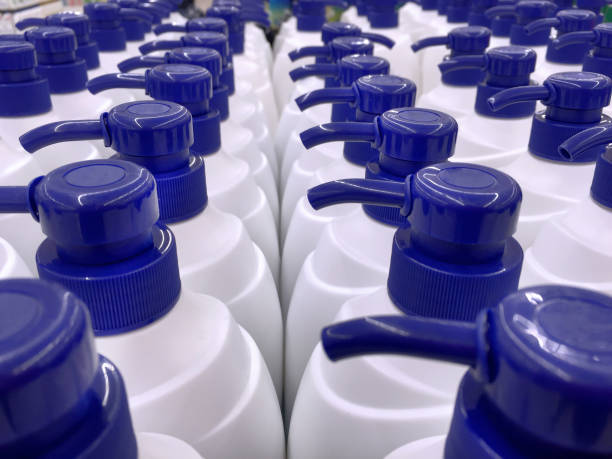 istock White Shampoo Bottles with Blue Dispensing Caps 879831106