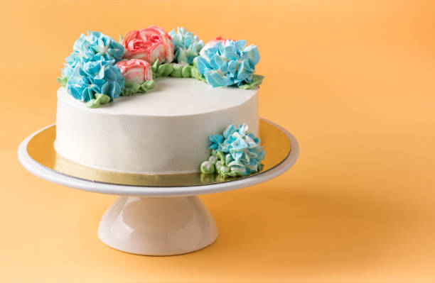 istock butter cake on cake stand and yellow background 879831228