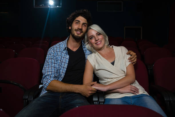 istock Couple watching movie in theatre 879832336