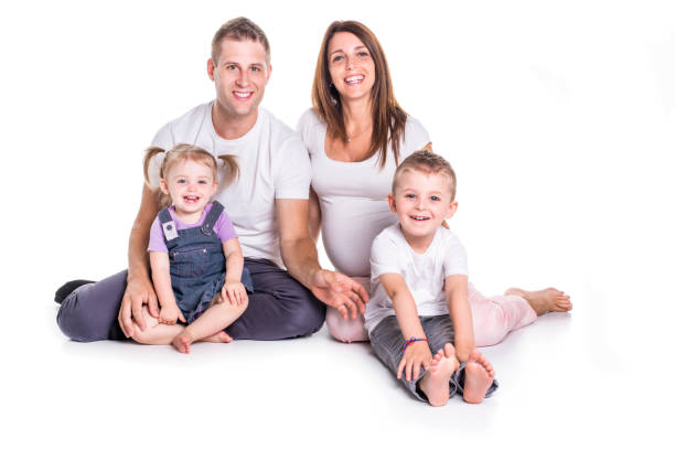 istock Happy family with two kids on studio white background 879837030