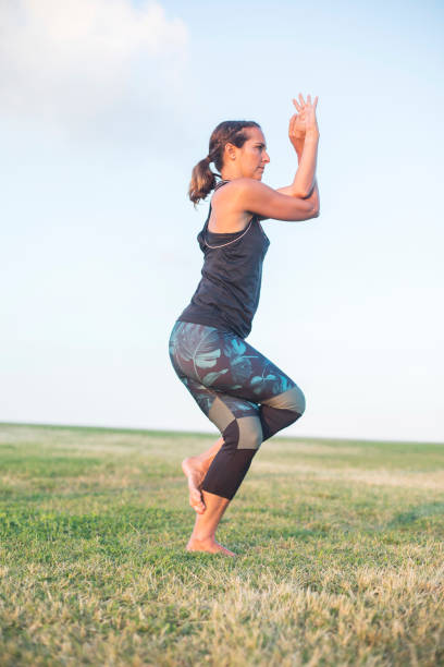 istock A Young woman doing yoga exercise outdoor 879837408