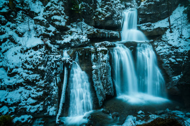 huge waterfall in austria after the first snowfall of the winter long exposure technique for soft silky water effect