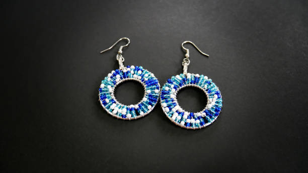 istock Blue and White Beaded Earrings on Gray Background 879845456