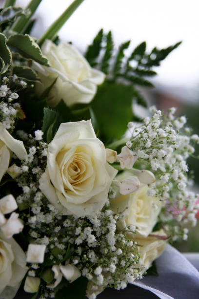 istock wedding bouquet of white roses 879848380