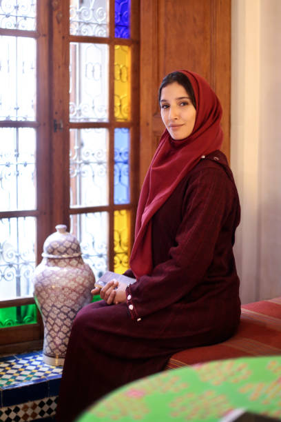 istock Arab woman at her home 879851264
