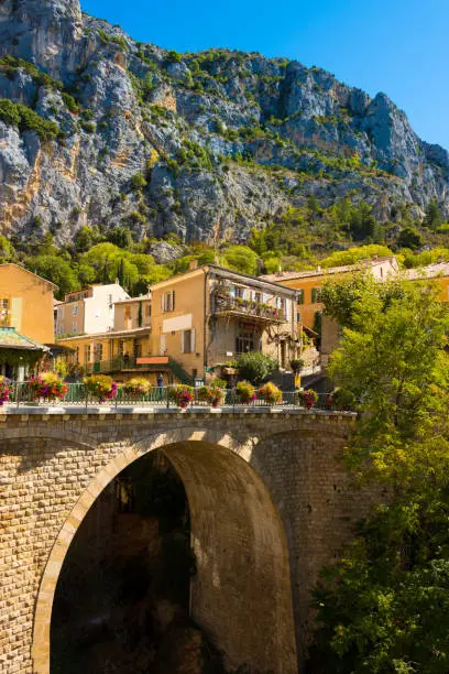 Photo of View of a stone bridge arch at the small historic mountain village of Moustiers-Sainte-Marie in Provence in southern France