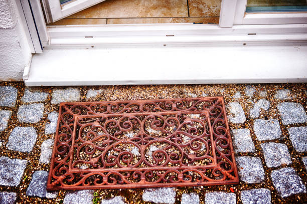 iron doormat in front of entrance from garden into the house