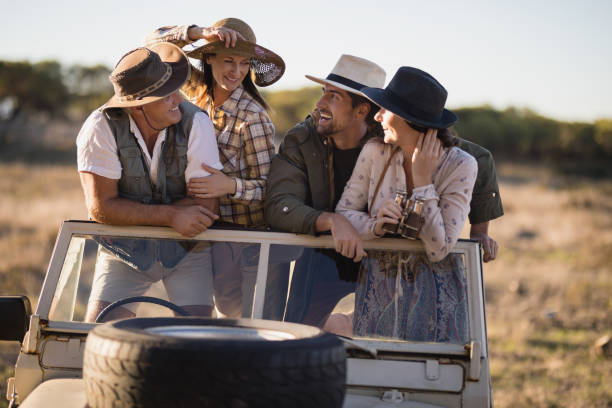 istock Happy friends enjoying during safari vacation 879896836