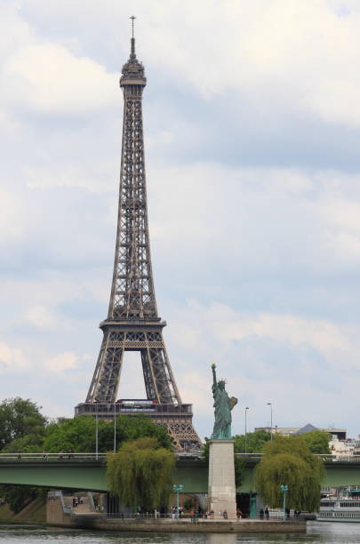 istock Urban scenic of Paris with Eiffel Tower and Liberty Statue 879897228