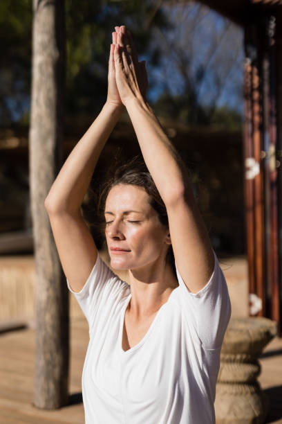 istock Beautiful woman practicing yoga 879897692