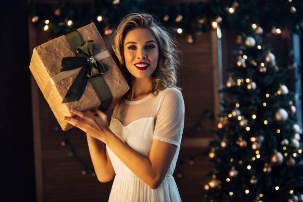 istock Beautiful woman with present 879897892