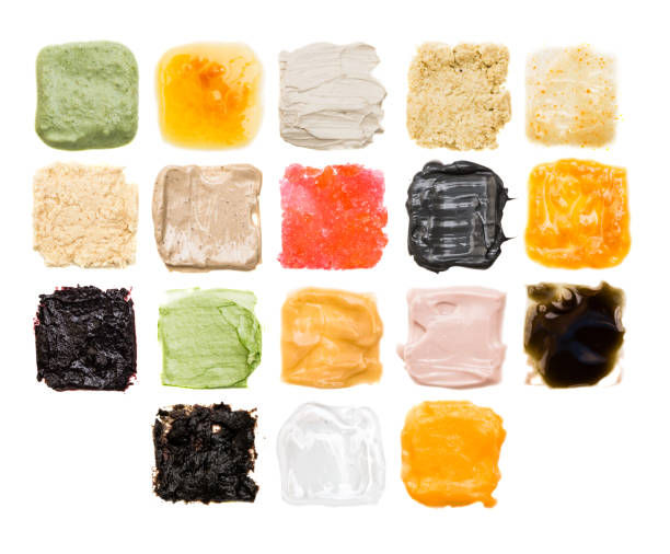 A lot of samples of different textures of cosmetics on a white background