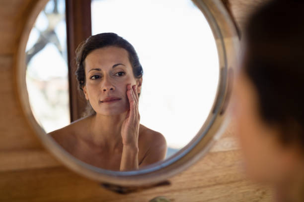 istock Woman looking at mirror in cottage 879916142