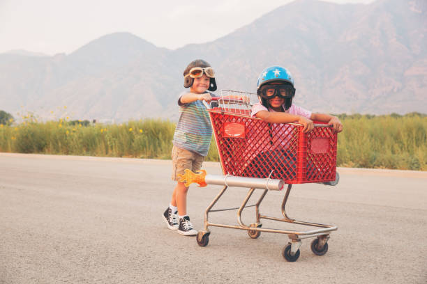 istock Young Boy Shopping Cart Racing Team 879916504
