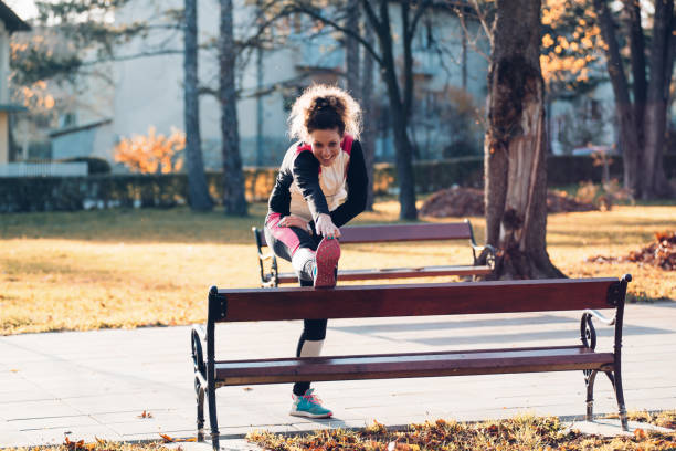 istock Woman training and jogging in the park 879917682