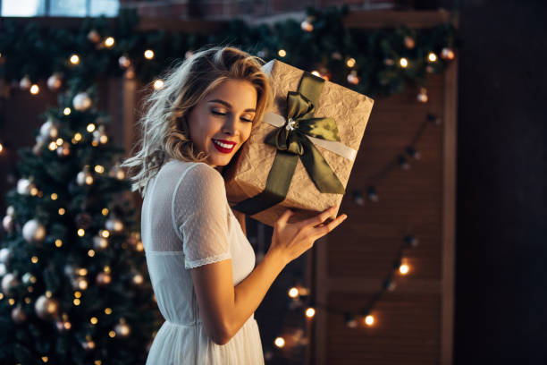 istock Beautiful woman with present 879922956