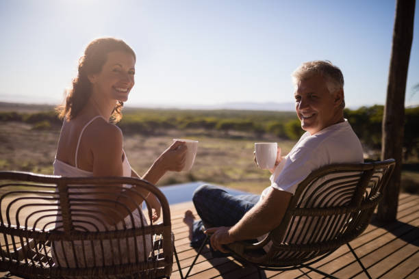 istock Senior couple having coffee while sitting at the resort 879928554